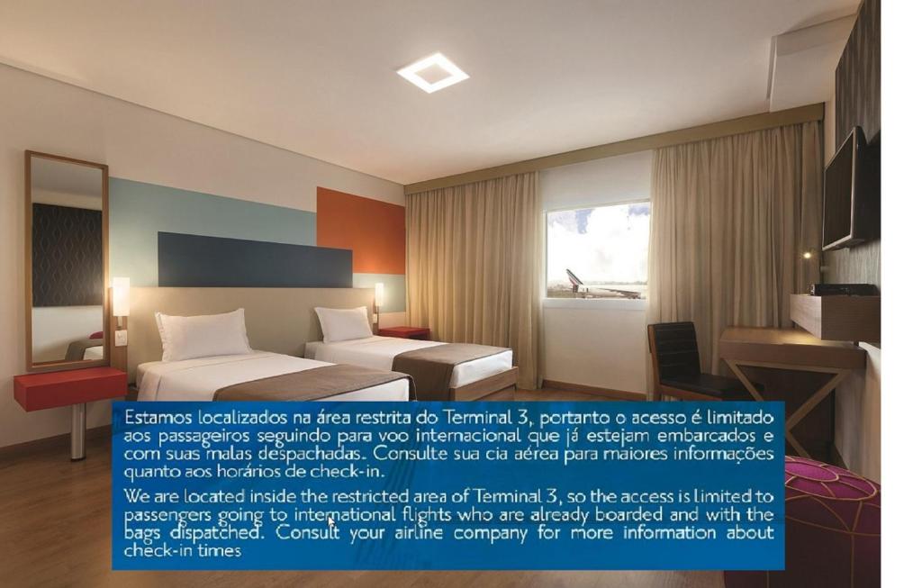 a poster of a bedroom with a bed and a window at TRYP BY WYNDHAM São Paulo Airport - Hotel de Transito Terminal 3 -Lado Ar - Área restrita á passageiros já embarcados - Piso 1 in Guarulhos