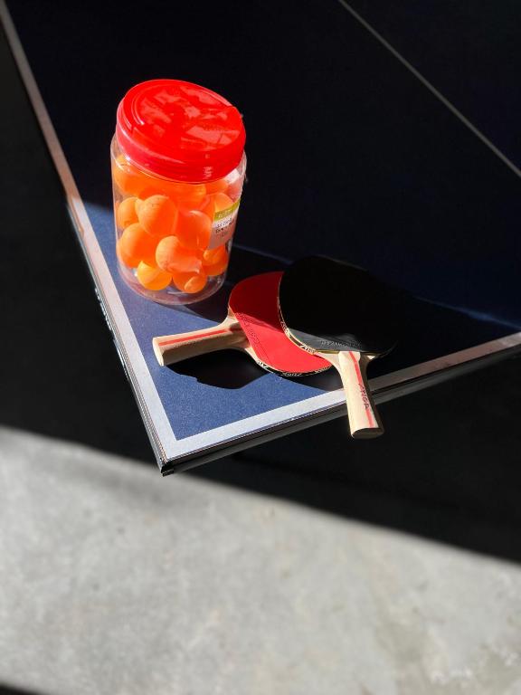 a spoon and a jar of oranges on a magazine at Rosebud Lovely House 2 - Mornington Peninsula 4 BR 3 Bath 2 story holiday house - BBQ - Beach - Hot spring in Rosebud