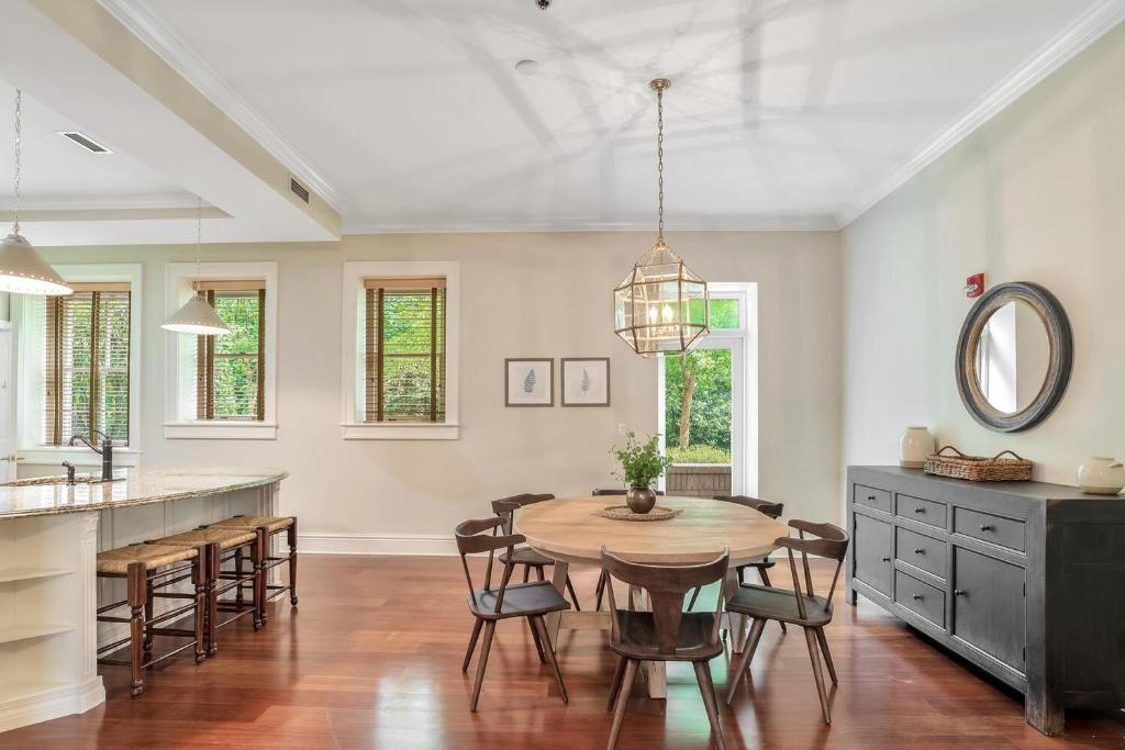 a kitchen and dining room with a table and chairs at 8 Village Lane 100 in Asheville