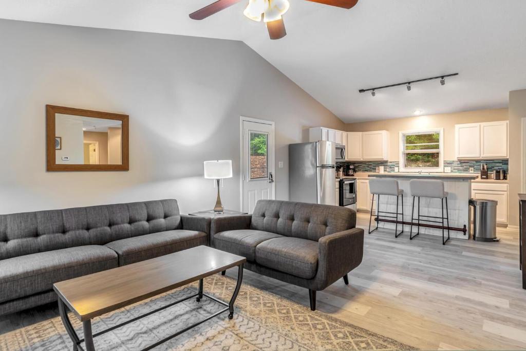 a living room with a couch and a table at South Asheville Townhome 16 A in Arden