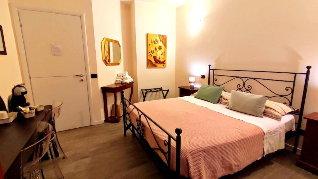 a bedroom with a bed with two pillows on it at il Sole di Baggio in Milan