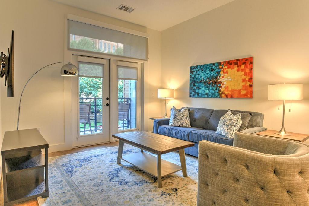 a living room with a couch and a table at 55 South Market Condo 204 in Asheville