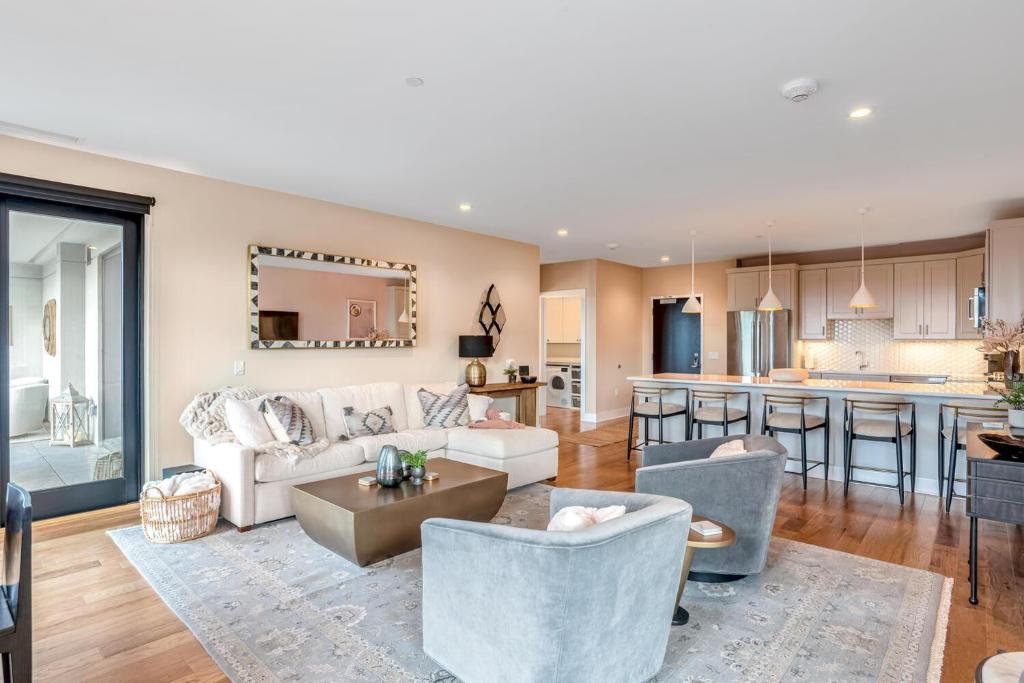 a living room with a couch and a table at Outstanding Luxury Downtown Condo in Asheville