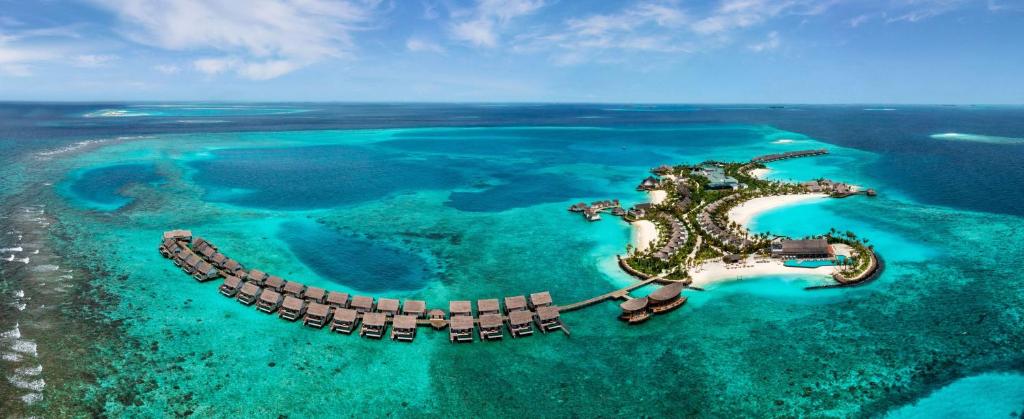 an island with a dragon in the water at Hilton Maldives Amingiri Resort & Spa in Male City