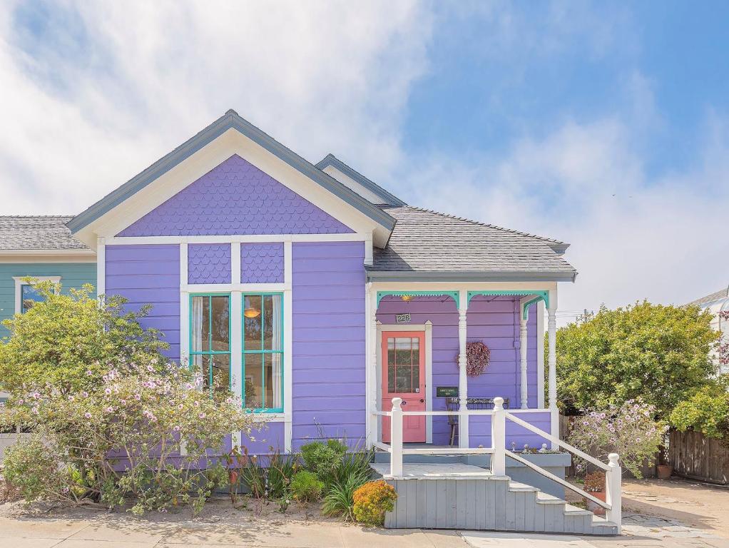 a purple house with a front porch at 3893 Sweet Seventeenth home in Pacific Grove