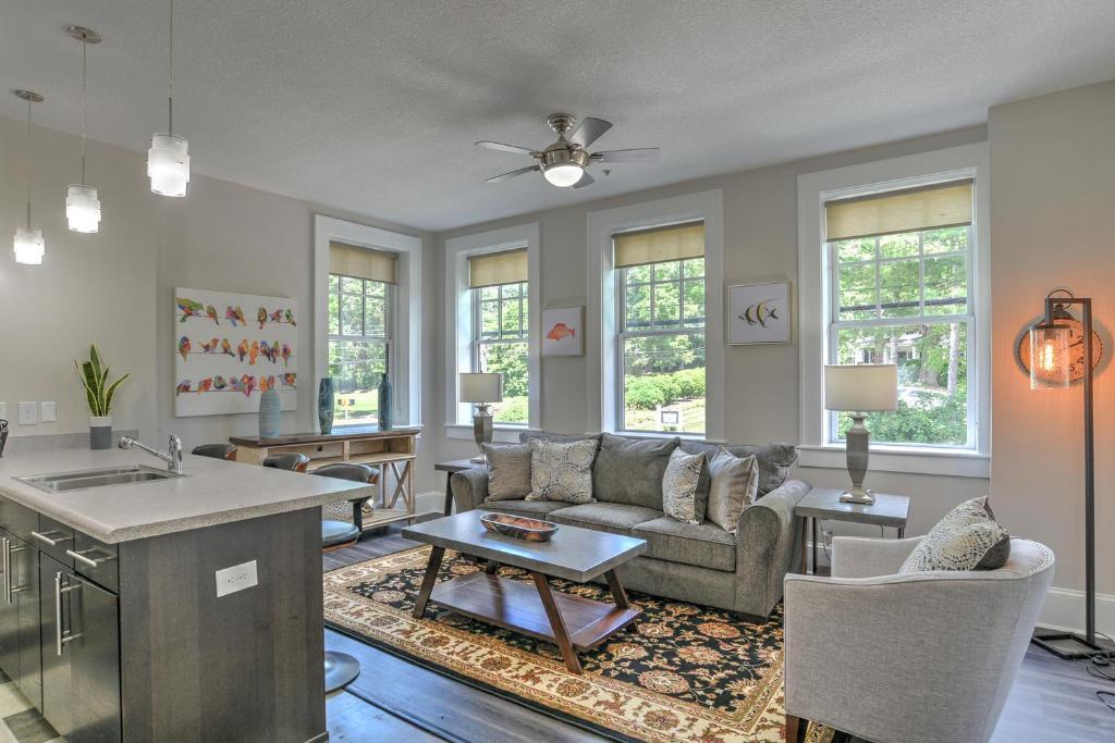 a living room with a couch and a table at Historic King James Unit 5 in Asheville