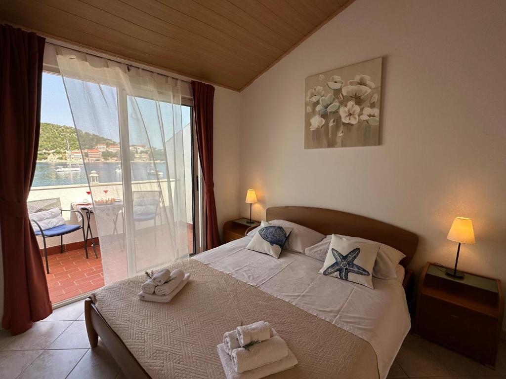 Postel nebo postele na pokoji v ubytování Apartments Marija