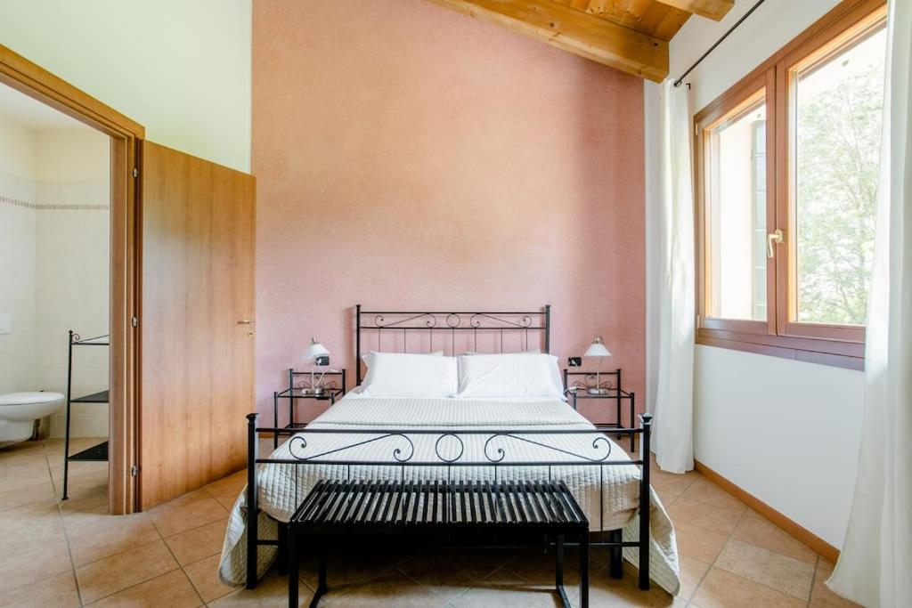 A bed or beds in a room at Agriturismo Ai Carpini
