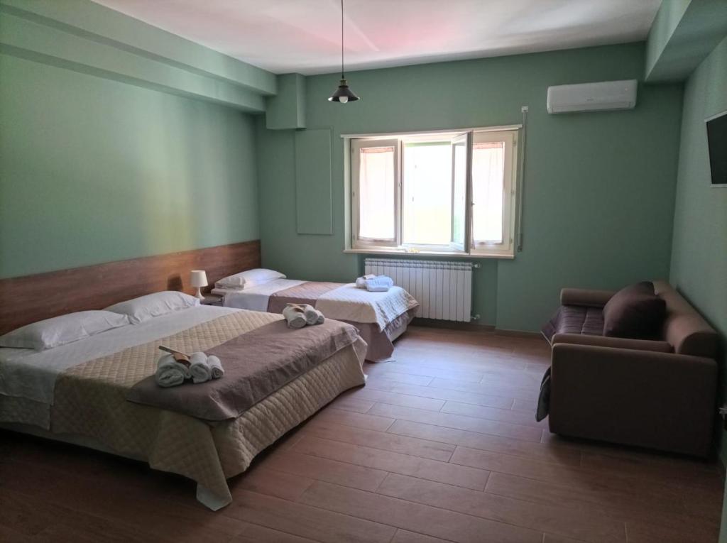 Postel nebo postele na pokoji v ubytování INCASTRO B&B IN CROTONE