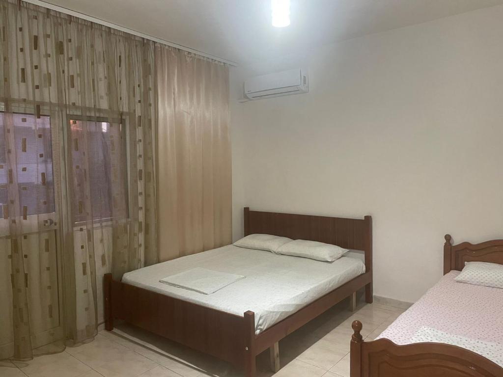 Postel nebo postele na pokoji v ubytování Ibras House