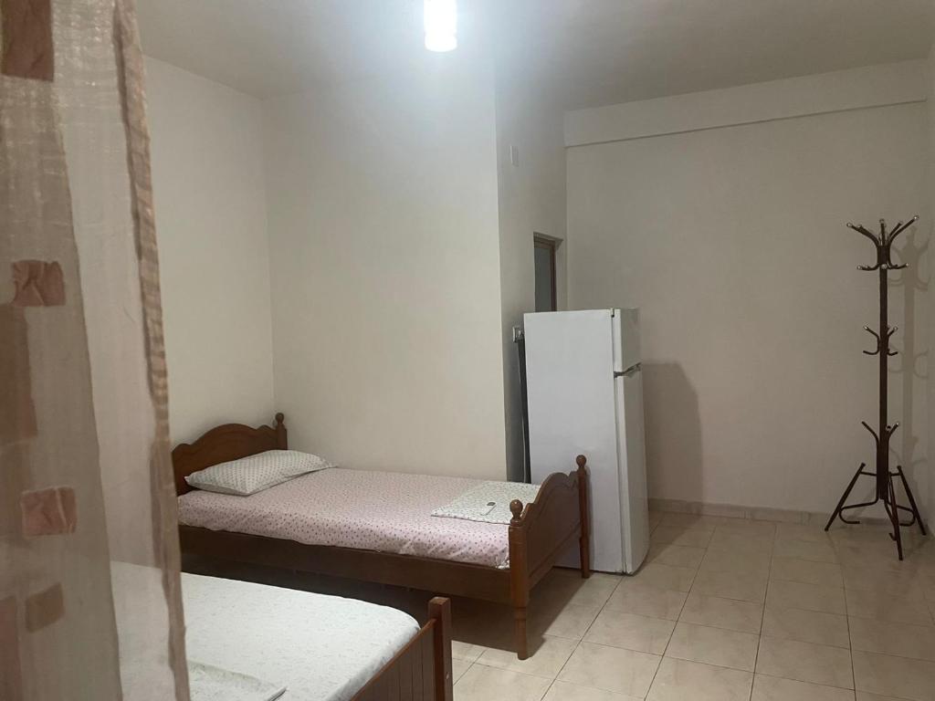 Postel nebo postele na pokoji v ubytování Ibras House