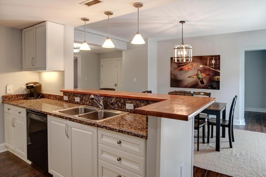 a kitchen with a sink and a counter top at 8 Village Lane 201 in Asheville