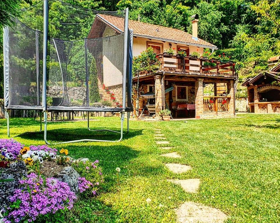 a house with a basketball hoop in a yard at Banja Luka house - Casa Rustica in Banja Luka