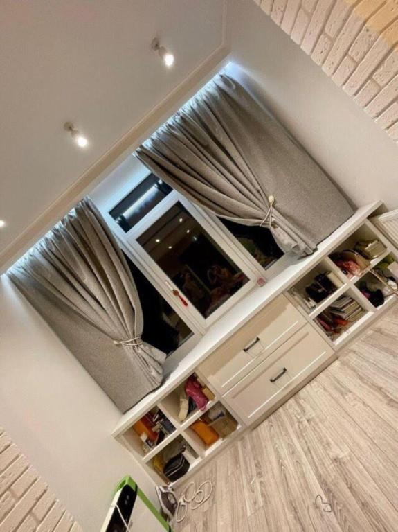 a wine cellar with white drawers in a room at Pearl KadoRR in Liski