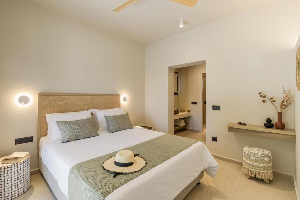 Postel nebo postele na pokoji v ubytování Topos Suites