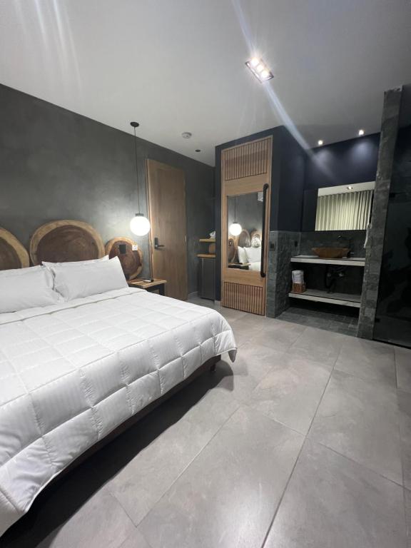 Postel nebo postele na pokoji v ubytování Hotel Zelva Negra