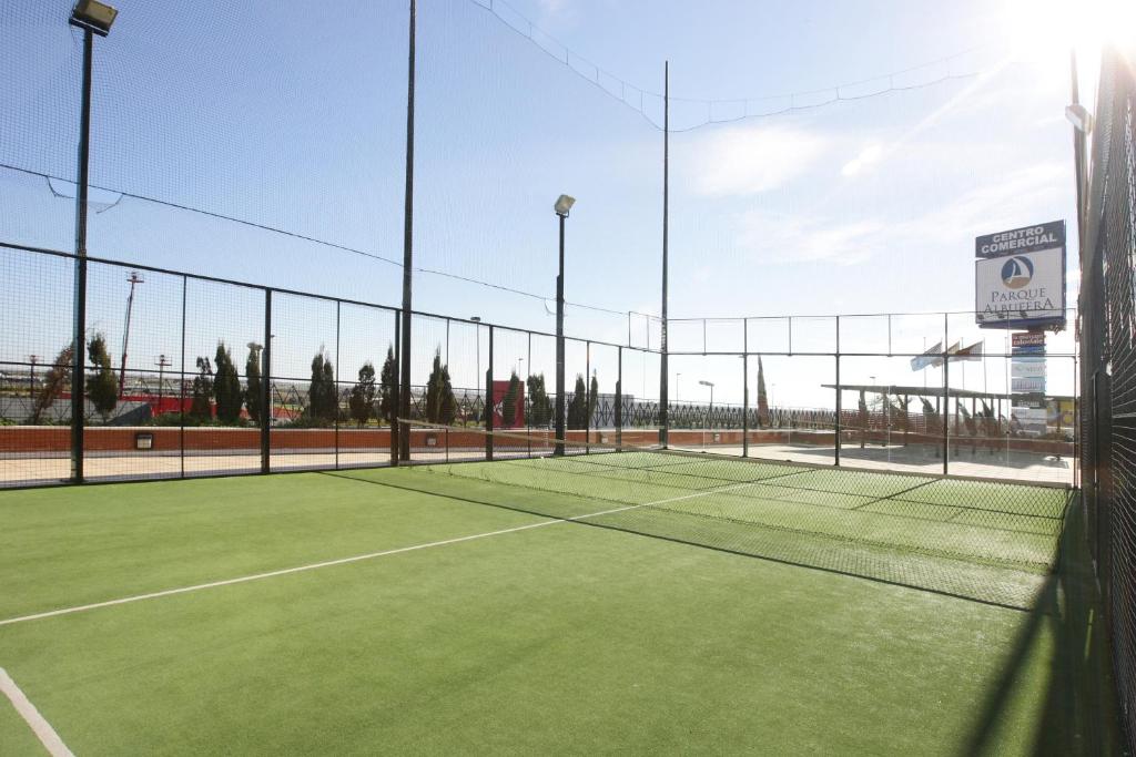 a tennis court with a net on top of it at Hotel Albufera in Alfafar
