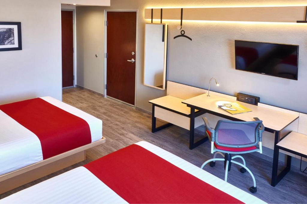 Postel nebo postele na pokoji v ubytování City Express by Marriott Leon