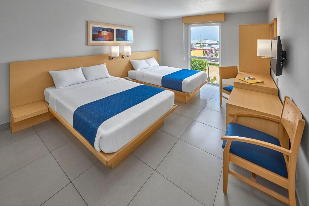 Postel nebo postele na pokoji v ubytování City Express by Marriott Minatitlán