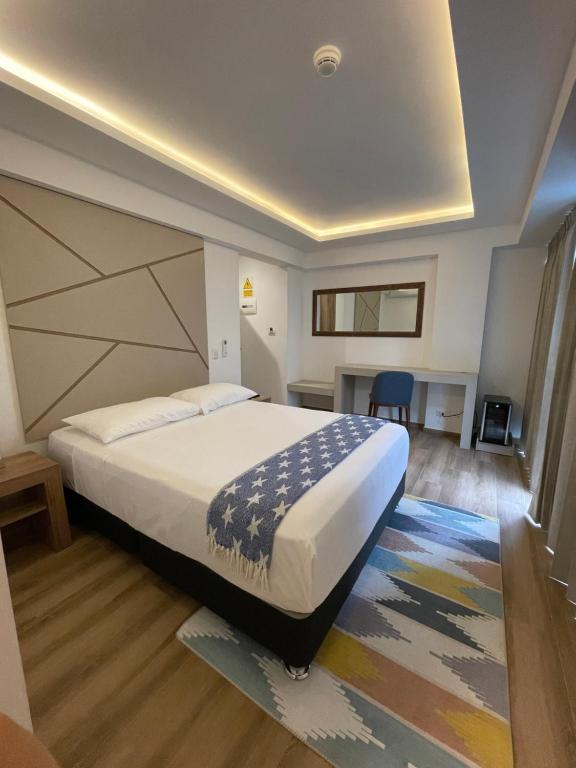 Postel nebo postele na pokoji v ubytování Grau Business Hotel
