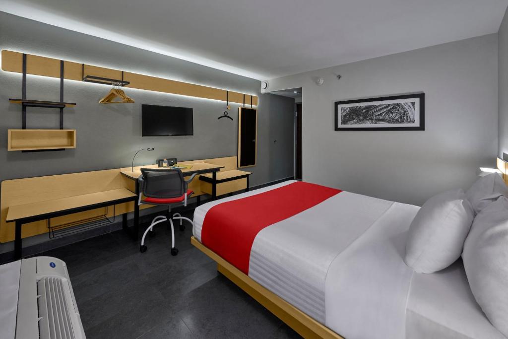 Postel nebo postele na pokoji v ubytování City Express by Marriott Veracruz