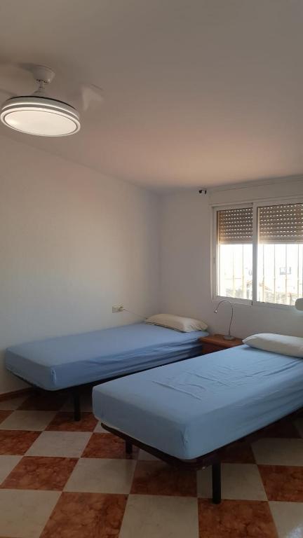 Posteľ alebo postele v izbe v ubytovaní Casita Beach Front