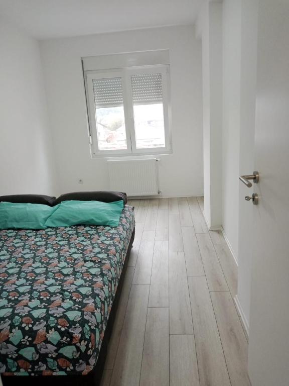 Postel nebo postele na pokoji v ubytování Apartman Nikolic