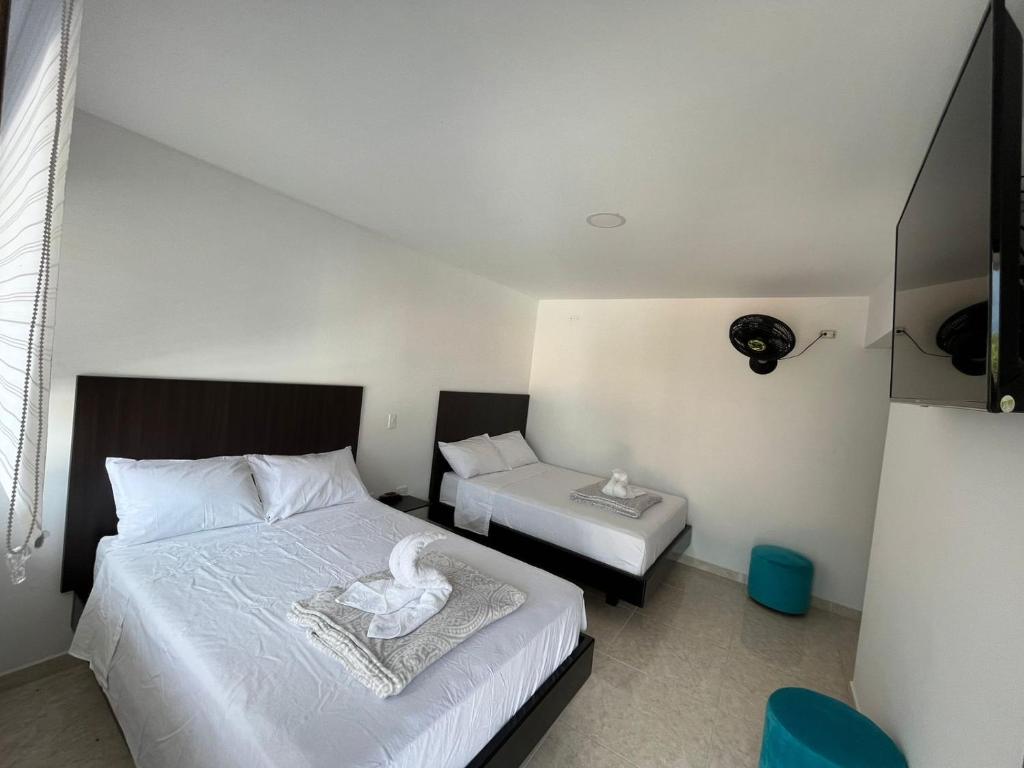 Llit o llits en una habitació de HOTEL SENDERO LAS GACHAS