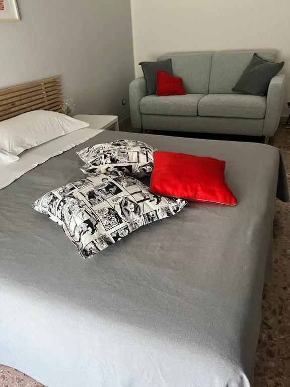 Łóżko lub łóżka w pokoju w obiekcie Sosta d'Oltremare