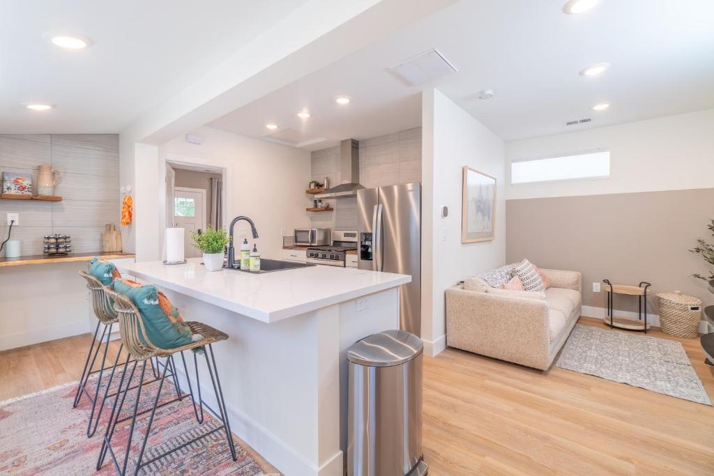 a kitchen and living room with a counter top at Reno Oasis: Stylish 1-Bedroom Escape in Reno