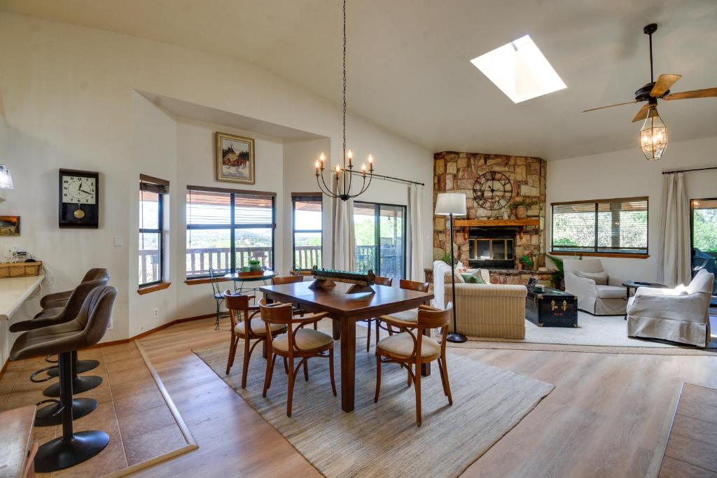 a dining room and living room with a table and chairs at Prescott Retreat with Gas Grill, Deck and Fireplace in Prescott