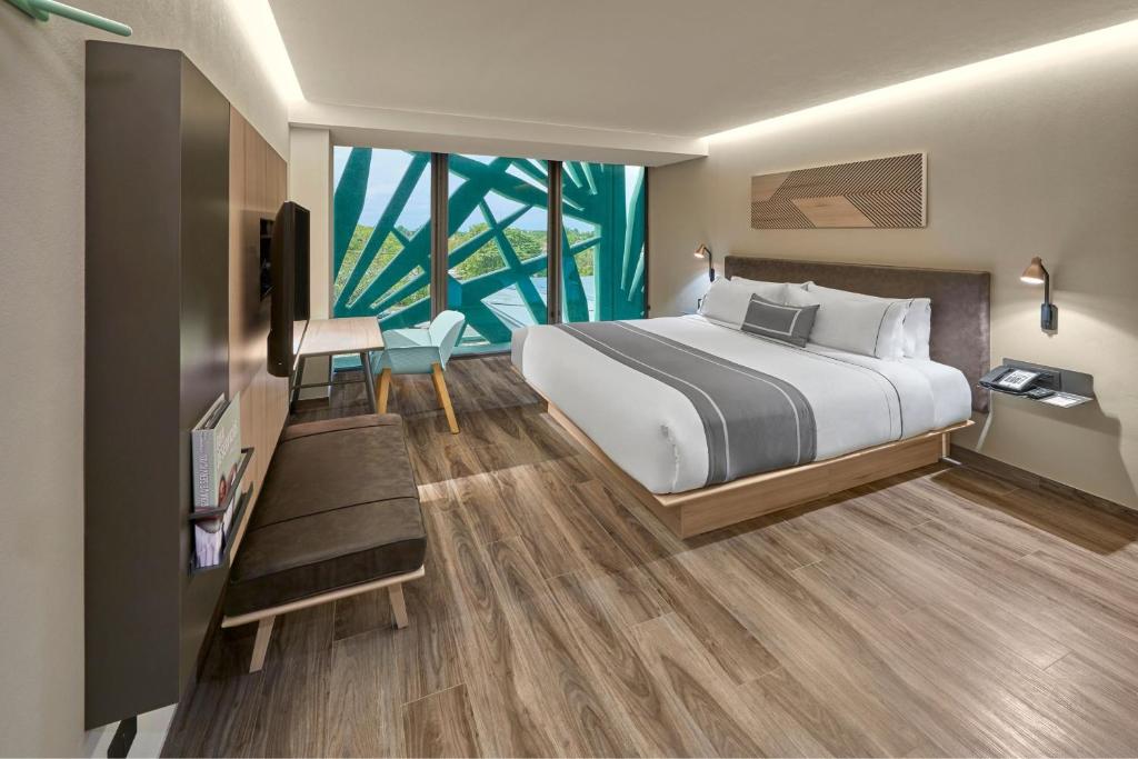 Postel nebo postele na pokoji v ubytování City Express Plus by Marriott Merida