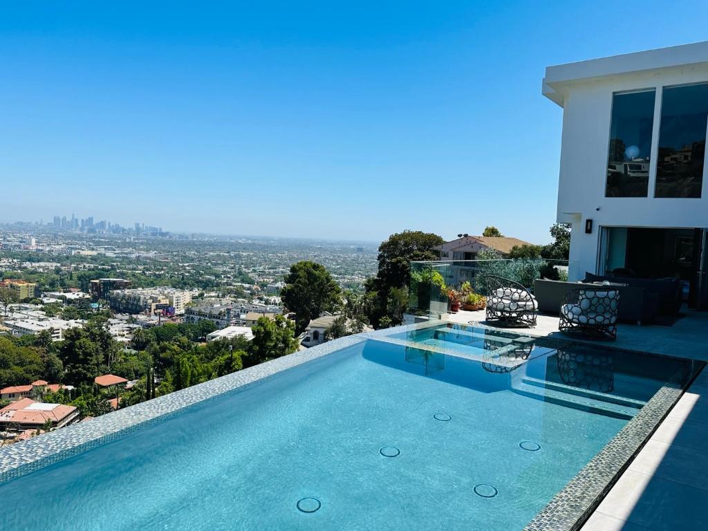 a swimming pool on top of a house at Vista Bliss Retreat-Private Room in Los Angeles