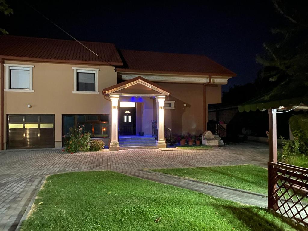 a house with a blue light on the front of it at Villa Magnifica in Strumica