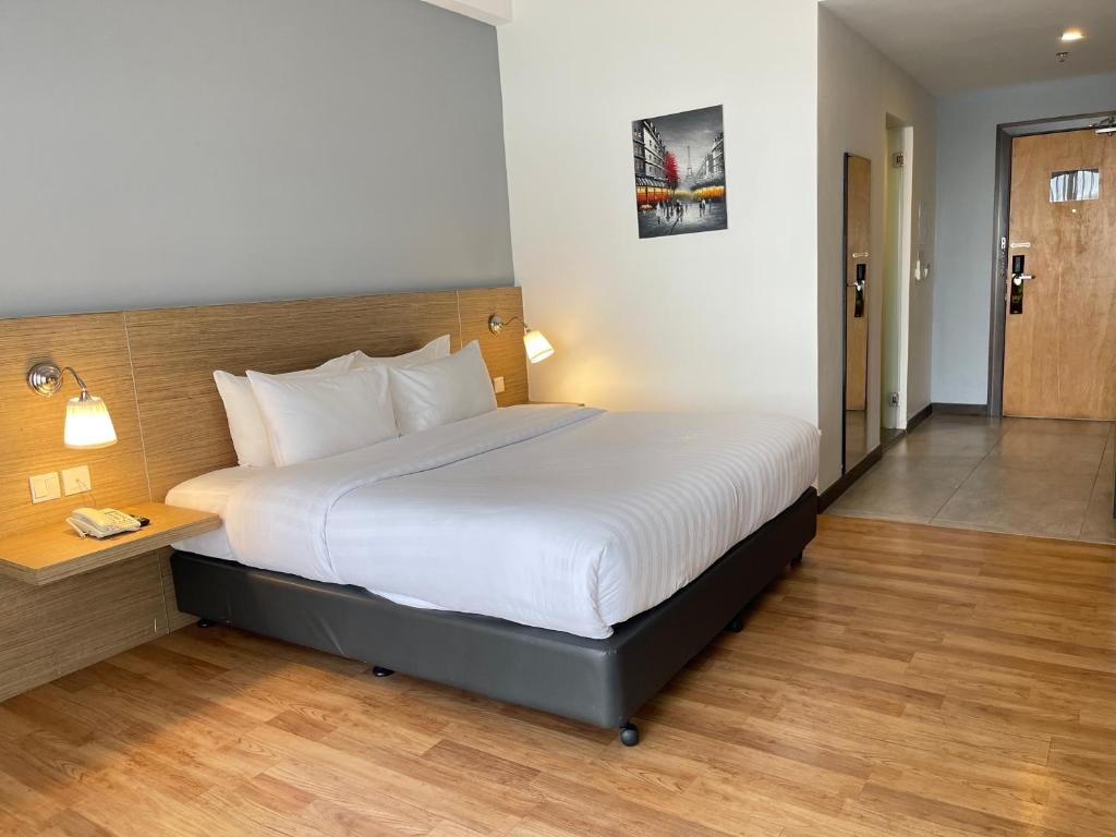 Postel nebo postele na pokoji v ubytování Win Hotel