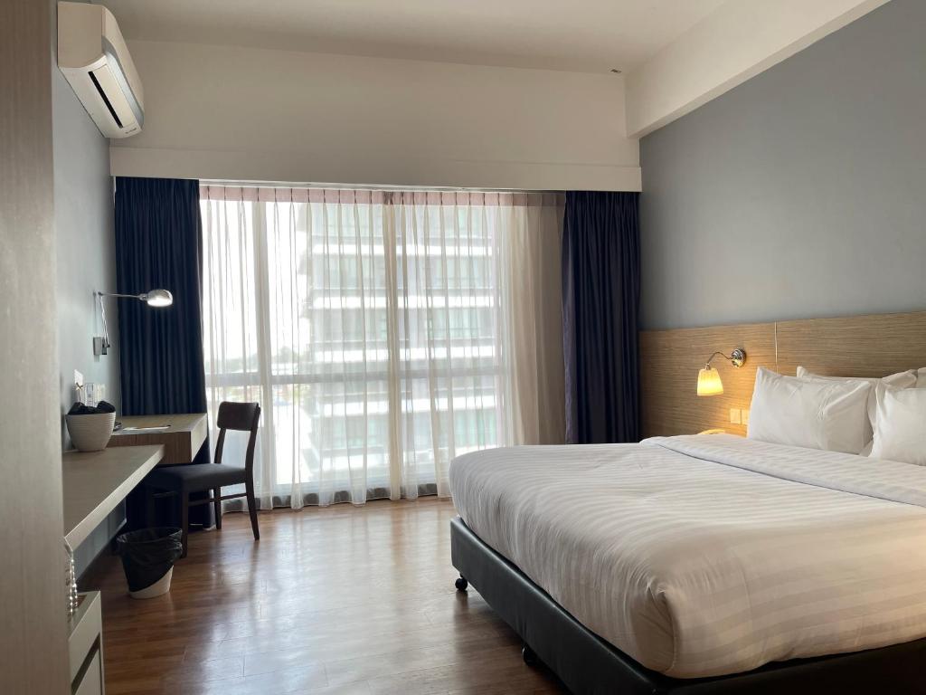 Postel nebo postele na pokoji v ubytování Win Hotel