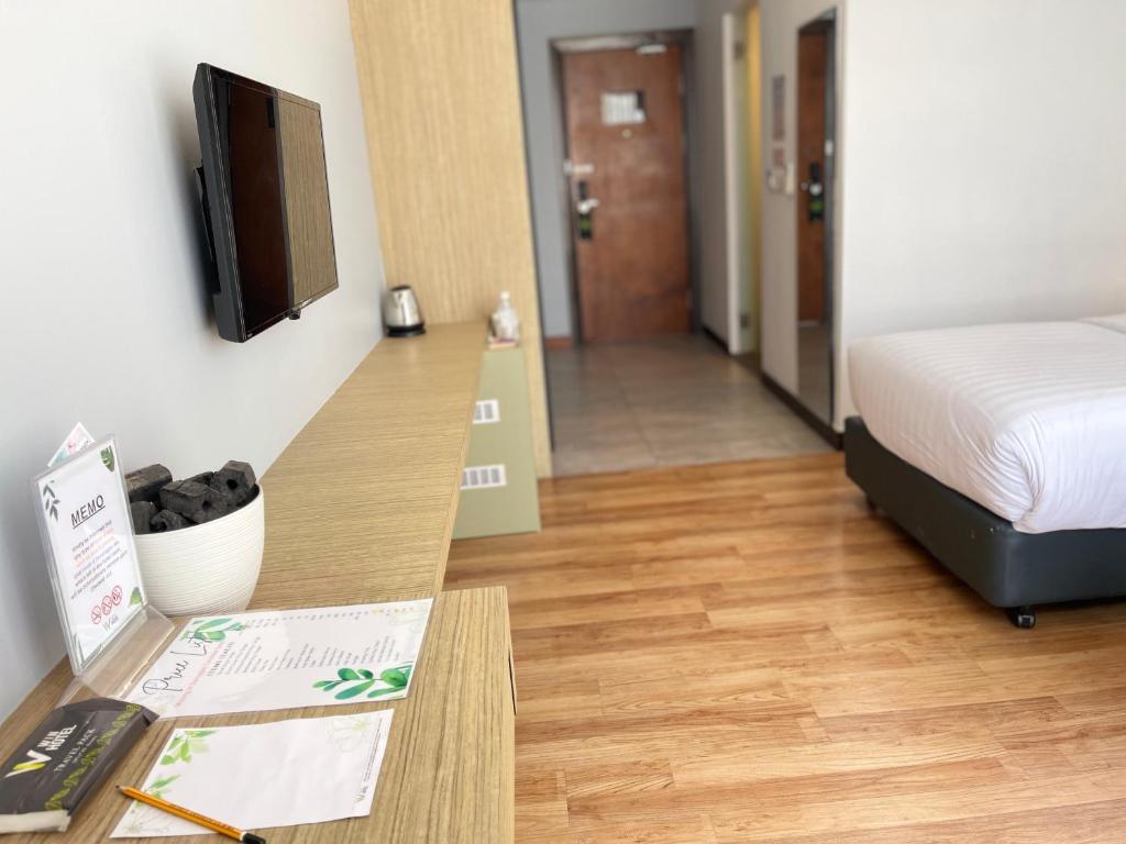 Postel nebo postele na pokoji v ubytování Win Hotel