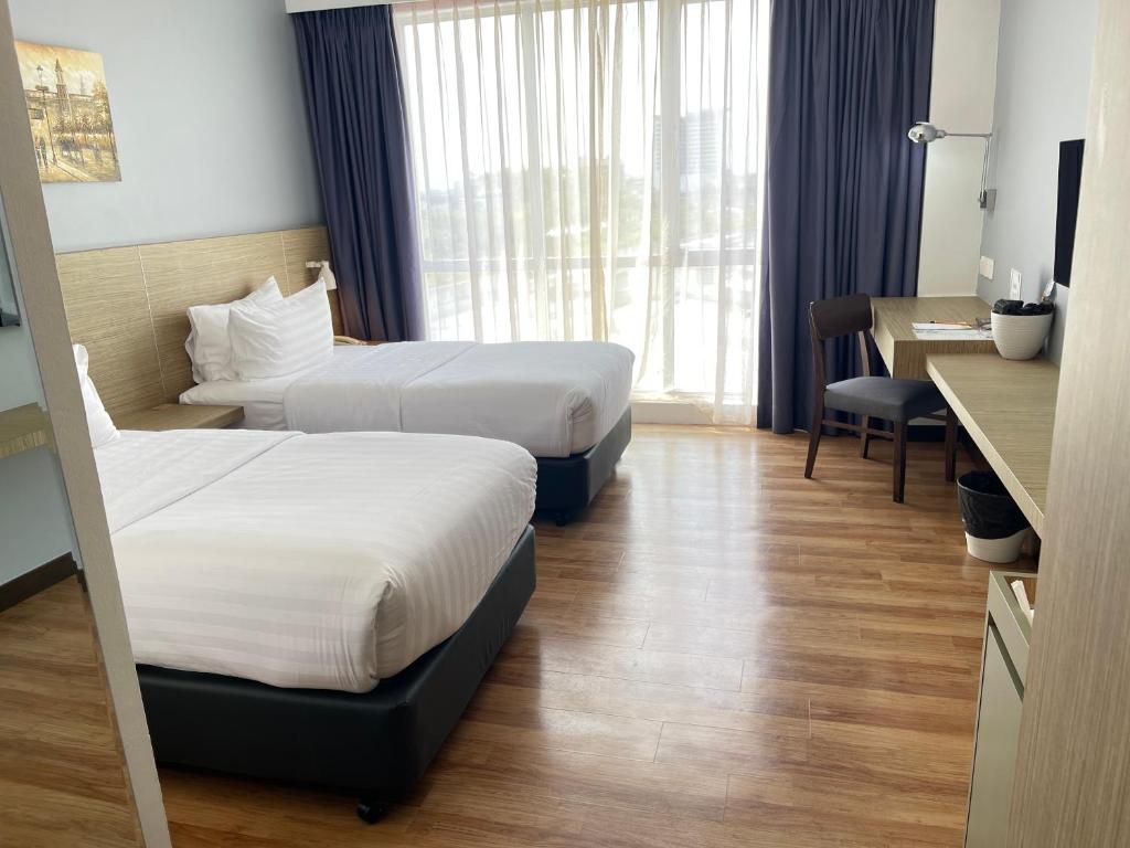 Postel nebo postele na pokoji v ubytování Win Hotel