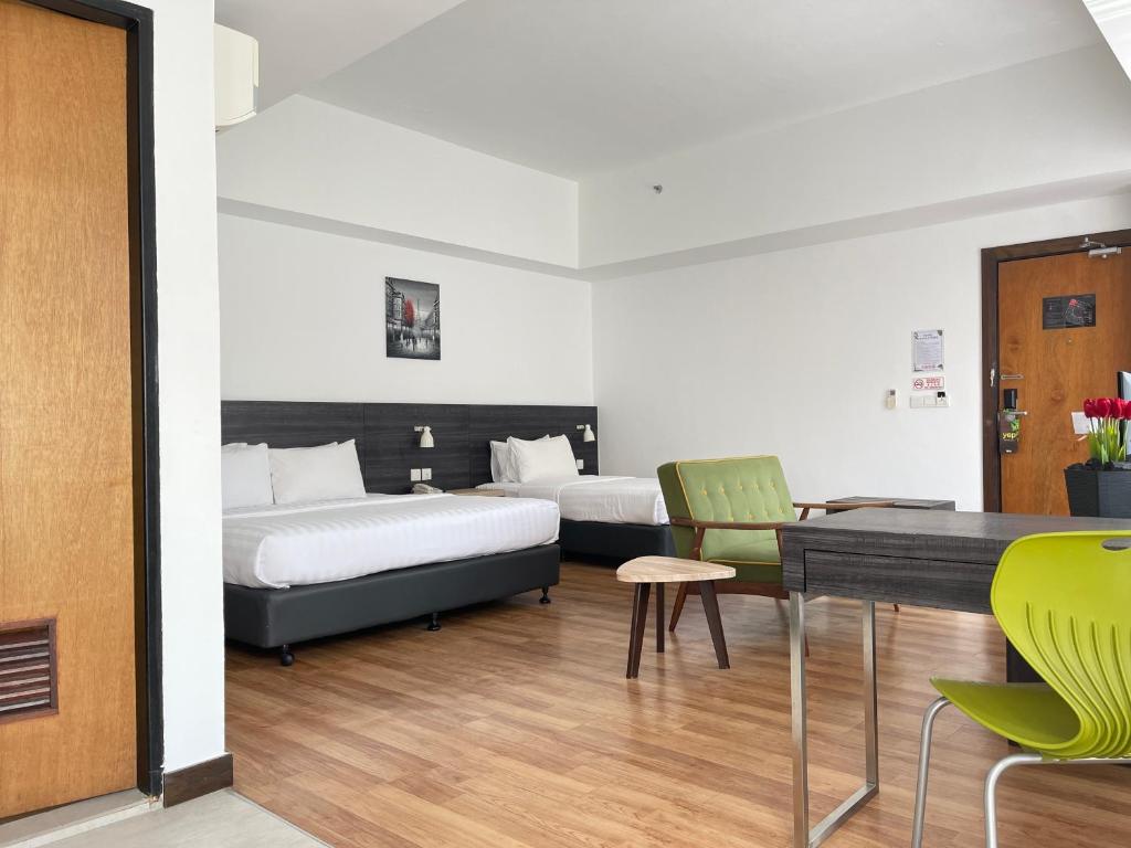 Postel nebo postele na pokoji v ubytování Win Hotel