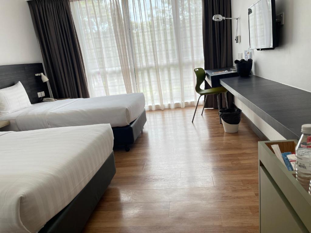 Postel nebo postele na pokoji v ubytování Win Hotel