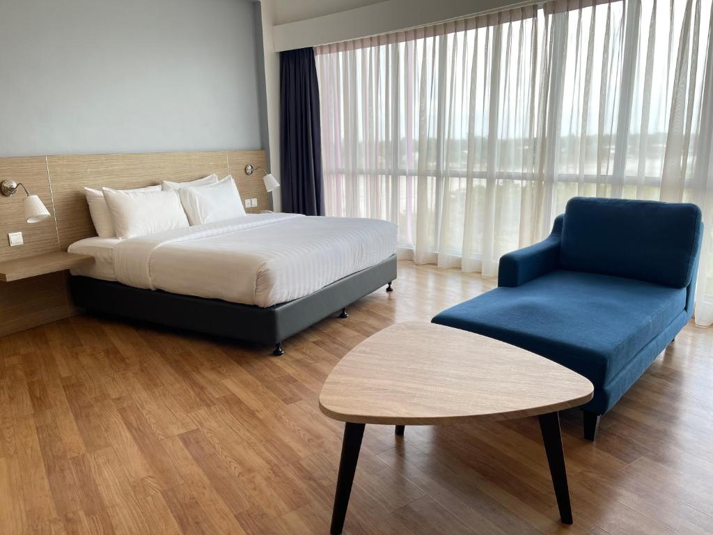 Postel nebo postele na pokoji v ubytování Win Hotel