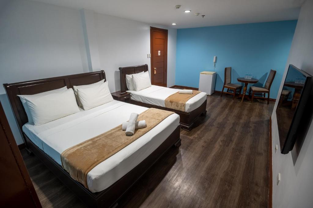 Postel nebo postele na pokoji v ubytování One Averee Bay Hotel