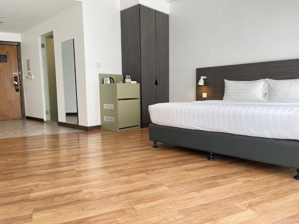 Postel nebo postele na pokoji v ubytování Win Hotel