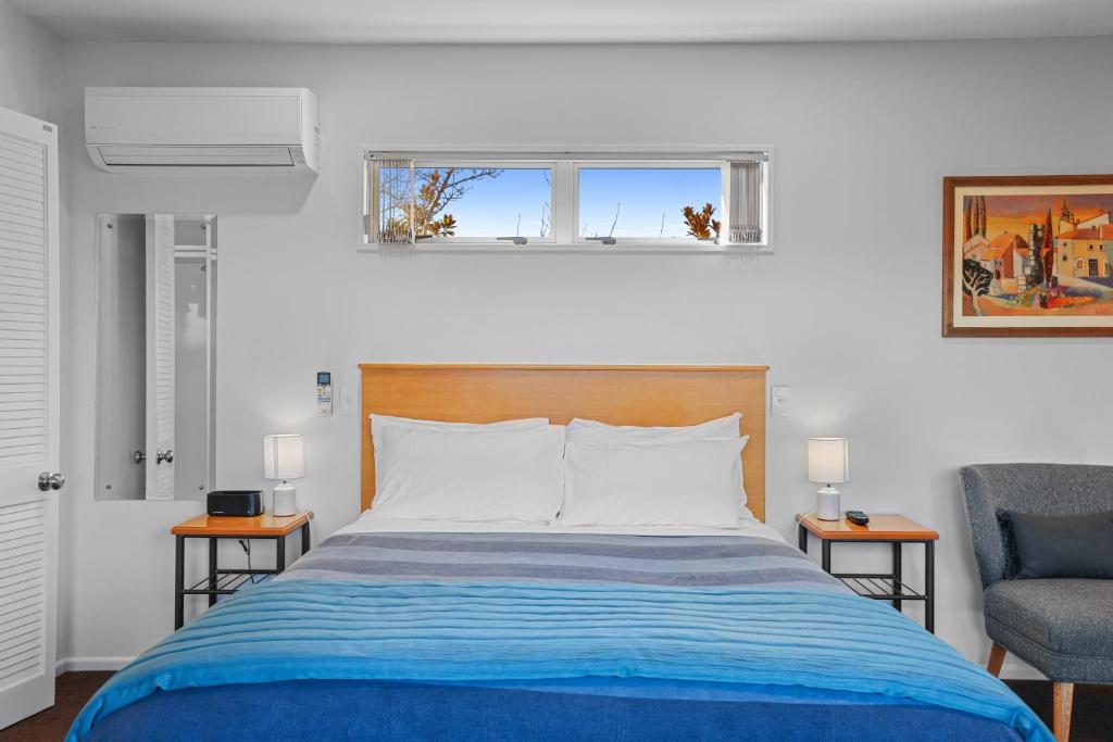 Postel nebo postele na pokoji v ubytování Lorenzo Motor Lodge
