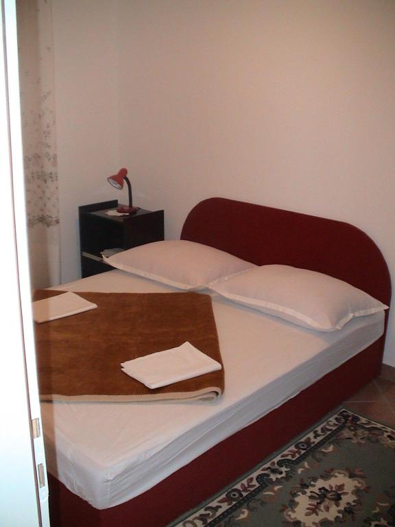 Posteľ alebo postele v izbe v ubytovaní Apartmani Glavina