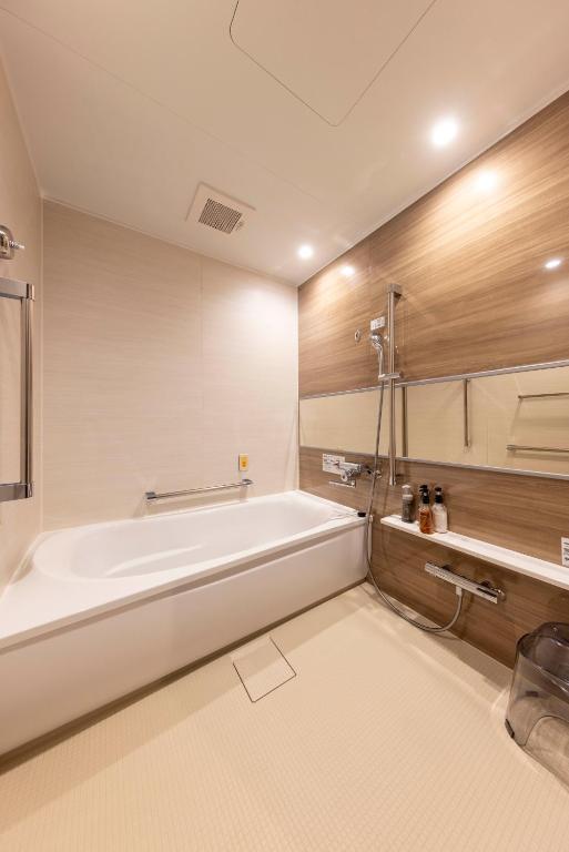 Postel nebo postele na pokoji v ubytování Hotel Granbinario Tsuruga