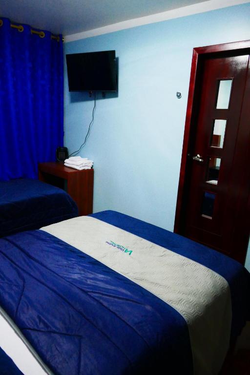 Postel nebo postele na pokoji v ubytování Hostal Valle Andino