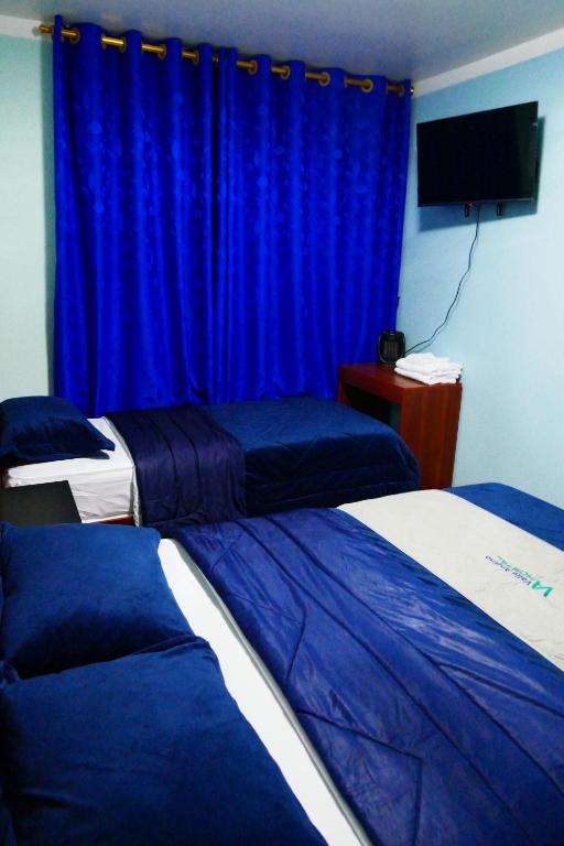 Postel nebo postele na pokoji v ubytování Hostal Valle Andino