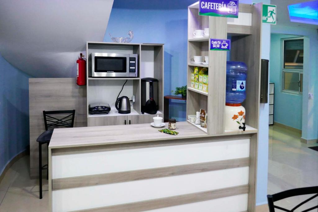 TV a/nebo společenská místnost v ubytování Hostal Valle Andino
