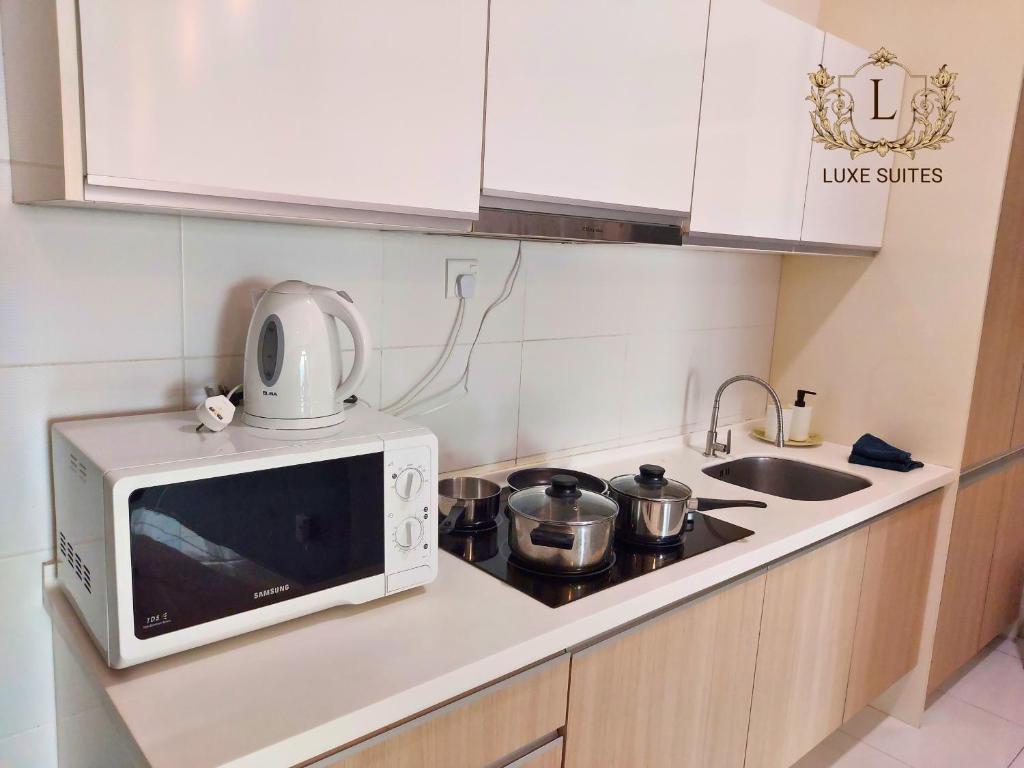 Kuchyň nebo kuchyňský kout v ubytování Luxe Suites at Skyloft